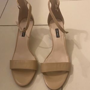 Tiny heel tan shoes.